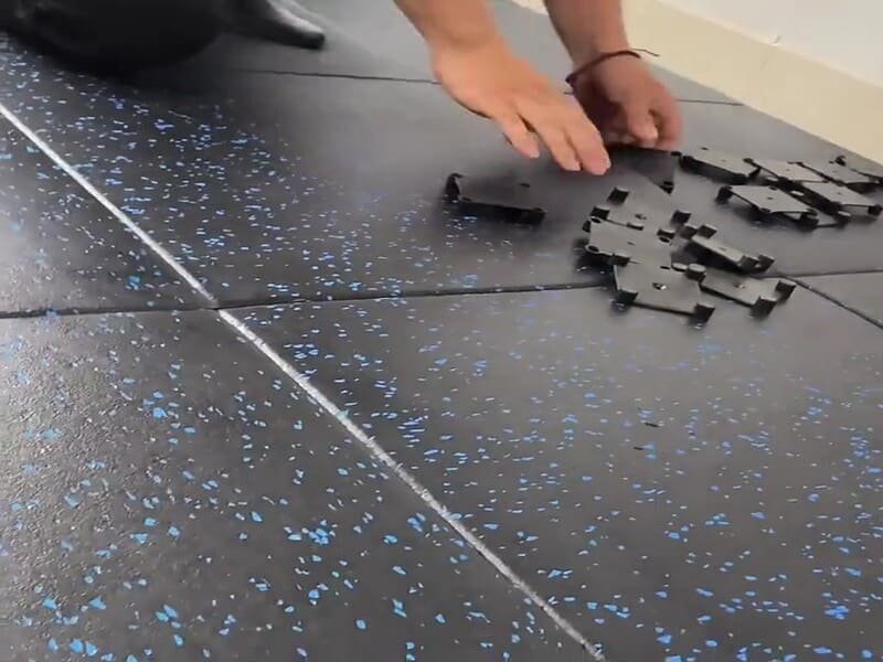 Heavy gym equipment on rubber mats